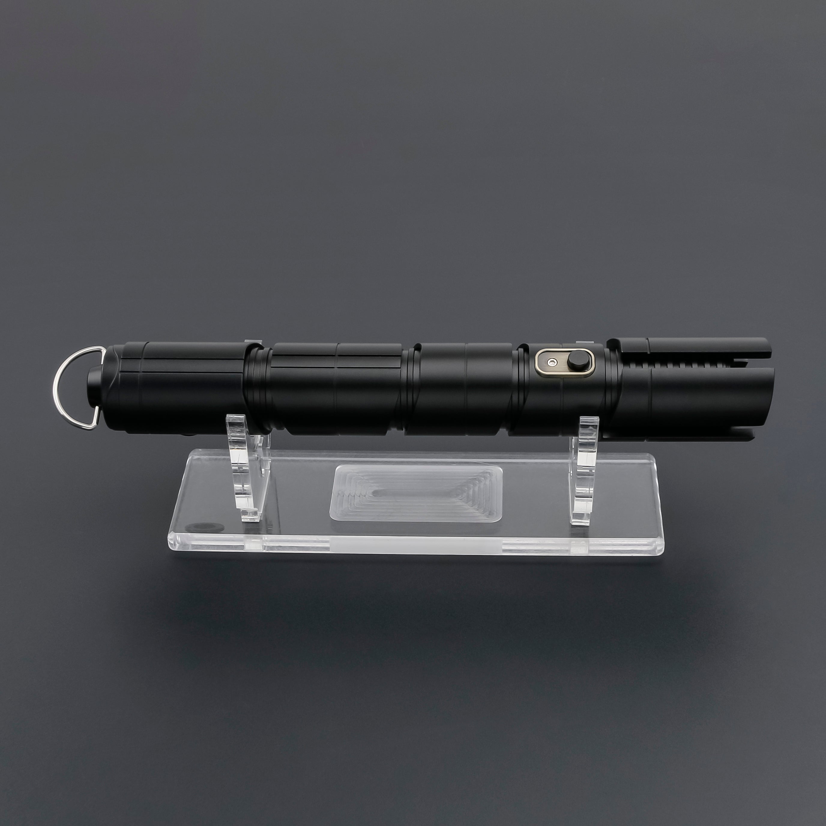 Qimir SE lightsaber on display stand